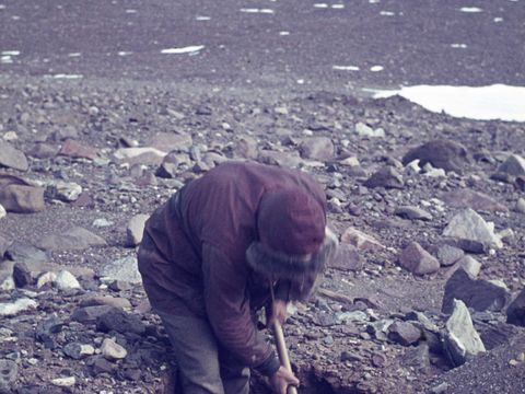 1964-355-G-Claridge-excavating-a-soil-pit-in-the-icy-permafrost.jpg