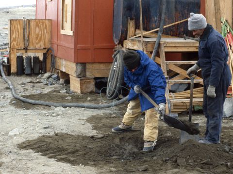 1990-097-M-Balks-G-Claridge-investigating-a-diesel-spill-at-Marble-Point-helo-refueling-station.jpg