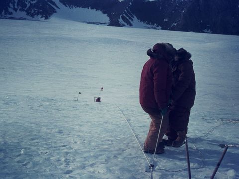 1969-206-Belaying-a-toboggan-down-a-steep-slope-on-the-Scott-Glacier.jpg