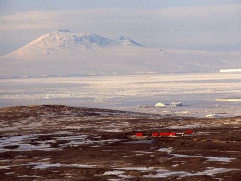 1991-131-View-from-the-Wilson-Piedmont-Glacier-of-Marble-Point-helo-refueling-facility-McMurdo-Sound-Mt-Erebus.jpg